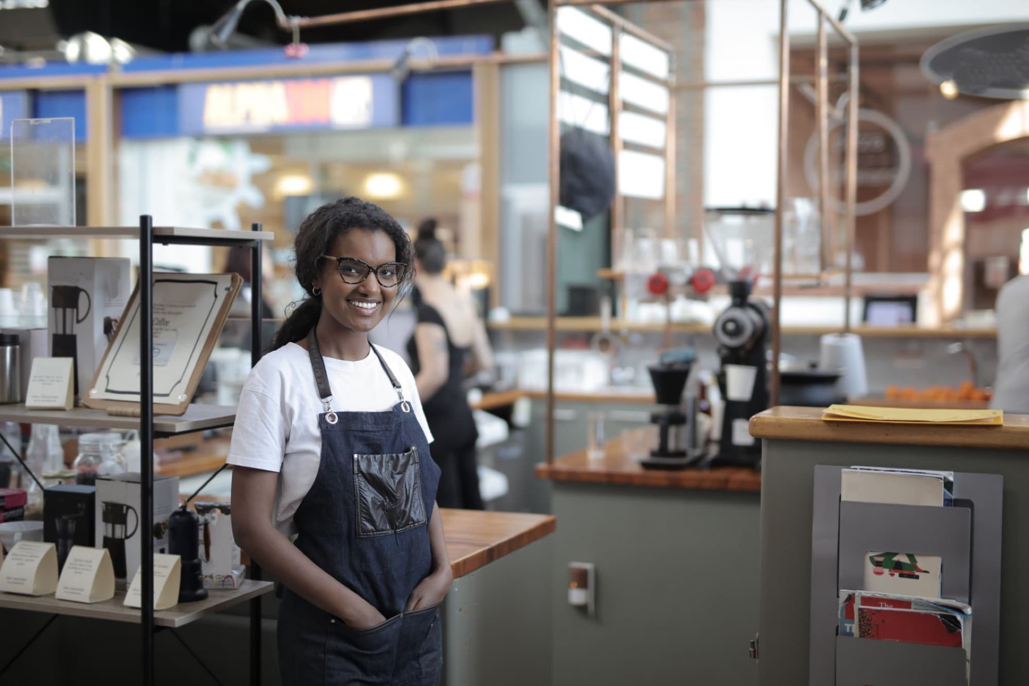 A small business owner at work behind the counter