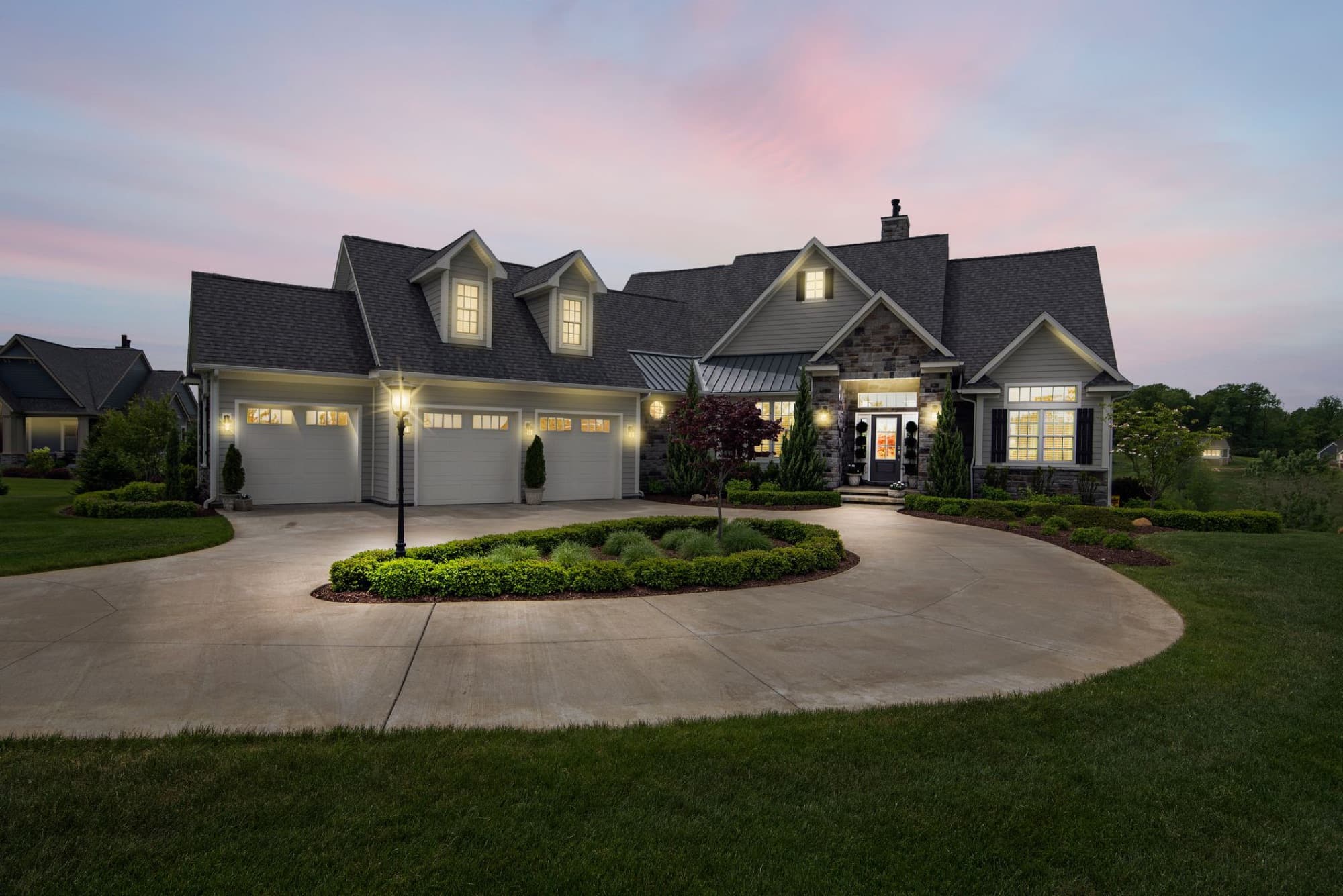 A two-story family home in the evening light