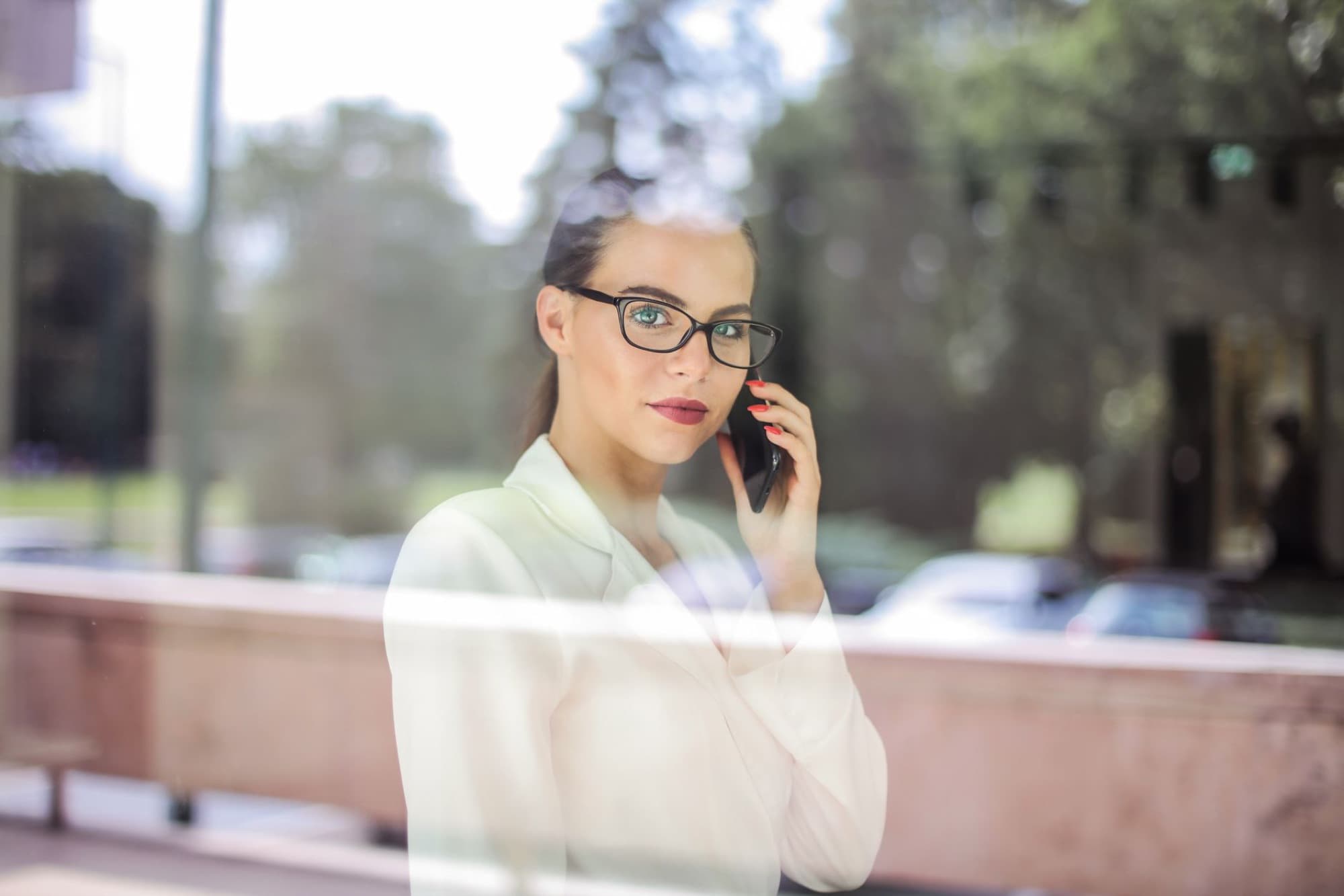 Someone on the phone by a window